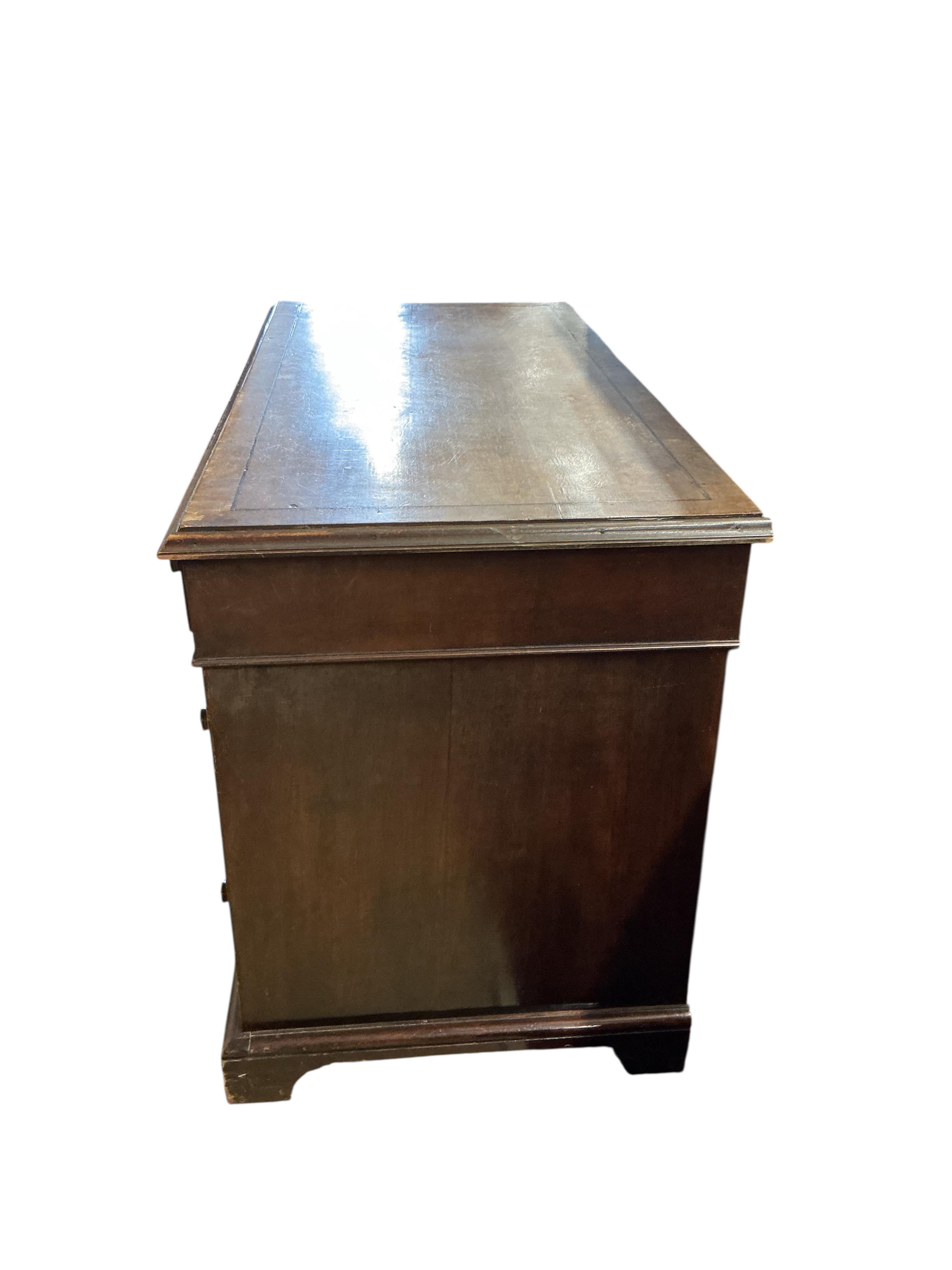 A George III style mahogany pedestal desk, width 122cm, depth 58cm, height 74cm